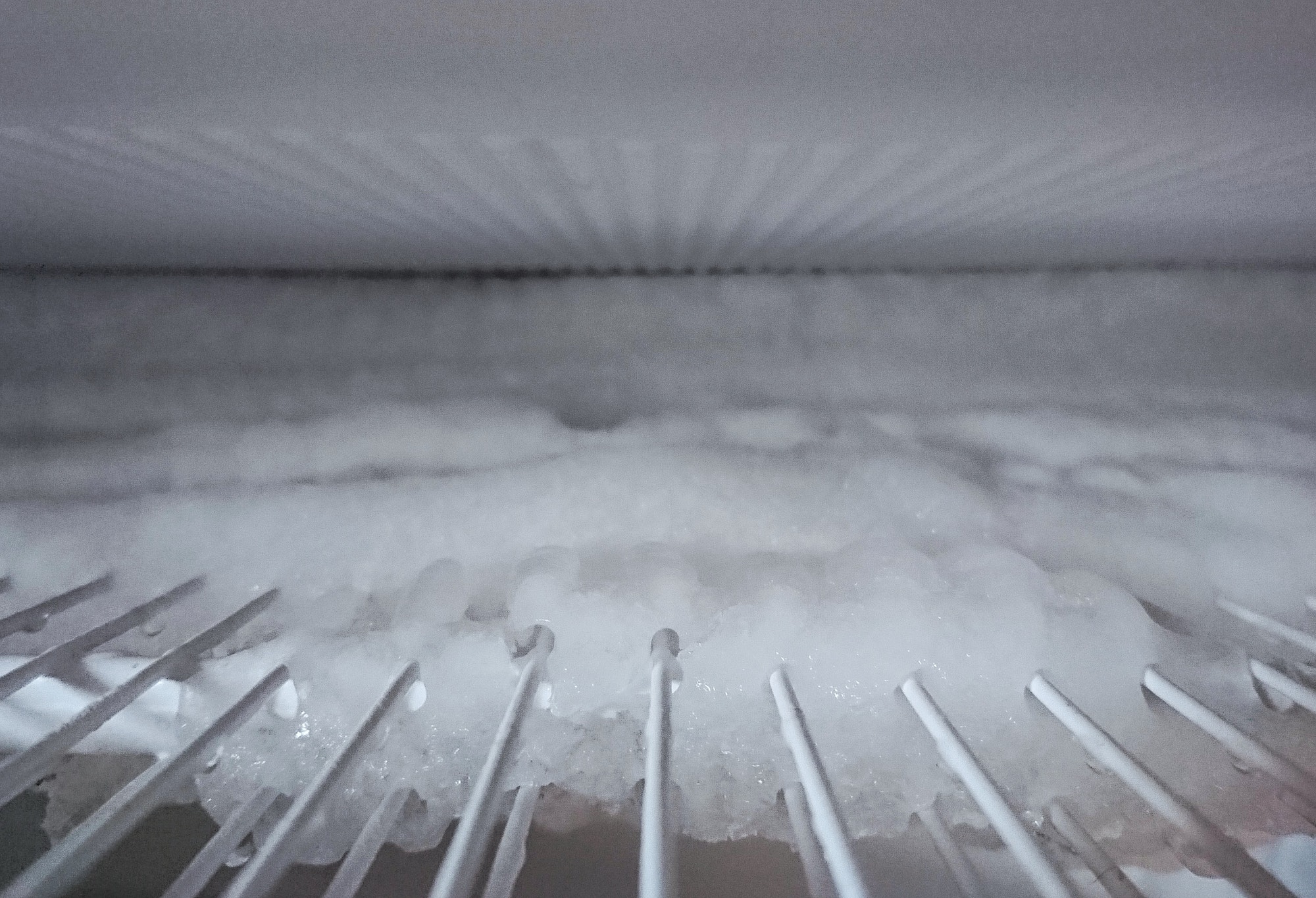 Defrost the freezer and refrigerator. Housekeeping, home keeping, house work, ice and frost, kitchen